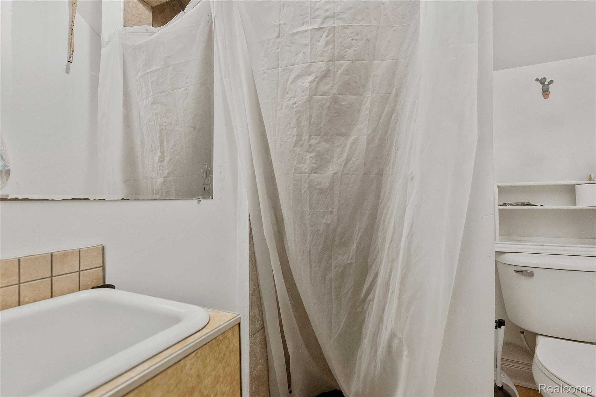 11429 East Eight Mile Road Warren, MI 48089 - Photo 12 of 23 Full bathroom featuring a shower stall and vanity