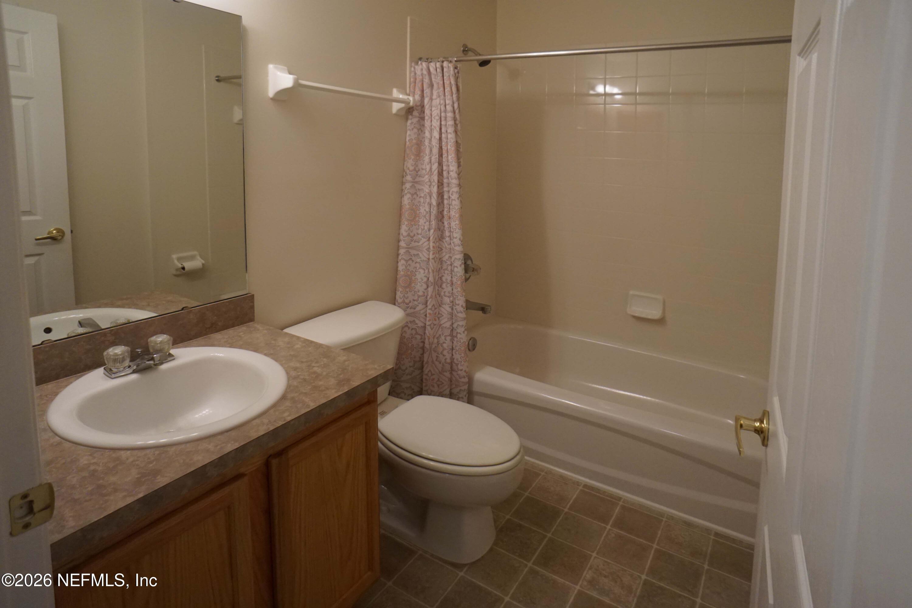 1721 Keswick Road St. Augustine, FL 32084 - Photo 13 of 17 a bathroom with a sink toilet and shower