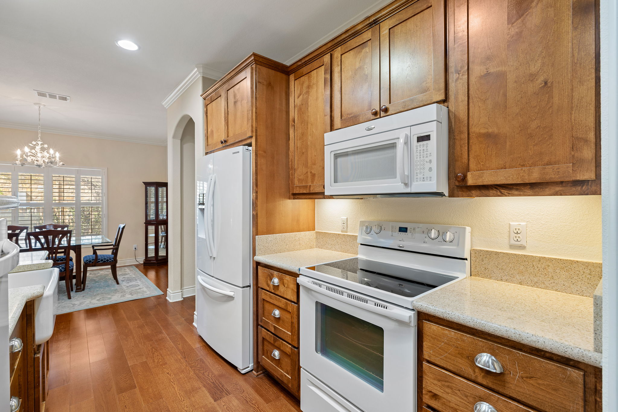 5201 Big Spring Street Georgetown, TX 78633 - Photo 12 of 26 a kitchen with a stove a sink and a refrigerator