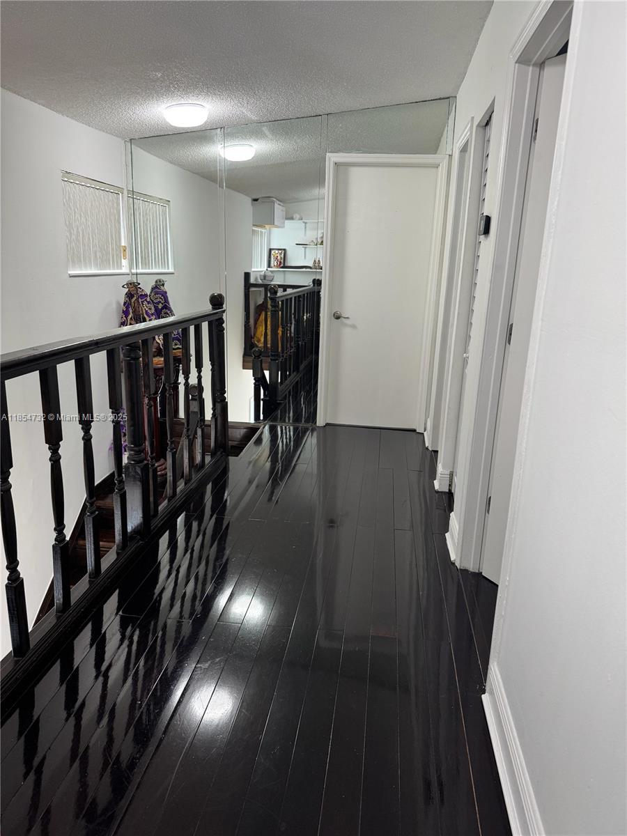 1671 Southwest 29th Avenue Miami, FL 33145 - Photo 17 of 21 a view of gallery with wooden floor
