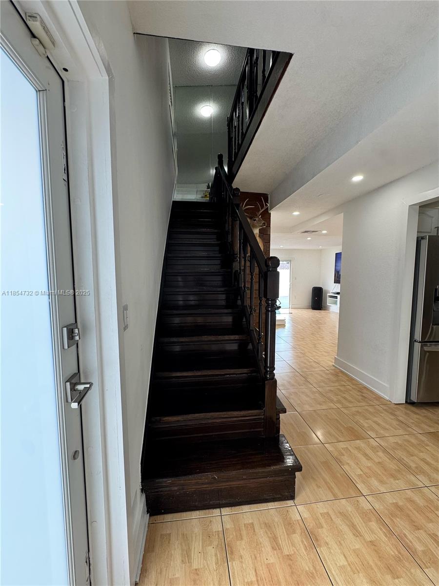1671 Southwest 29th Avenue Miami, FL 33145 - Photo 18 of 21 a view of entryway and hall with wooden floor
