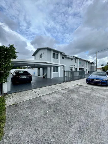 a view of a car parked in front of a house
