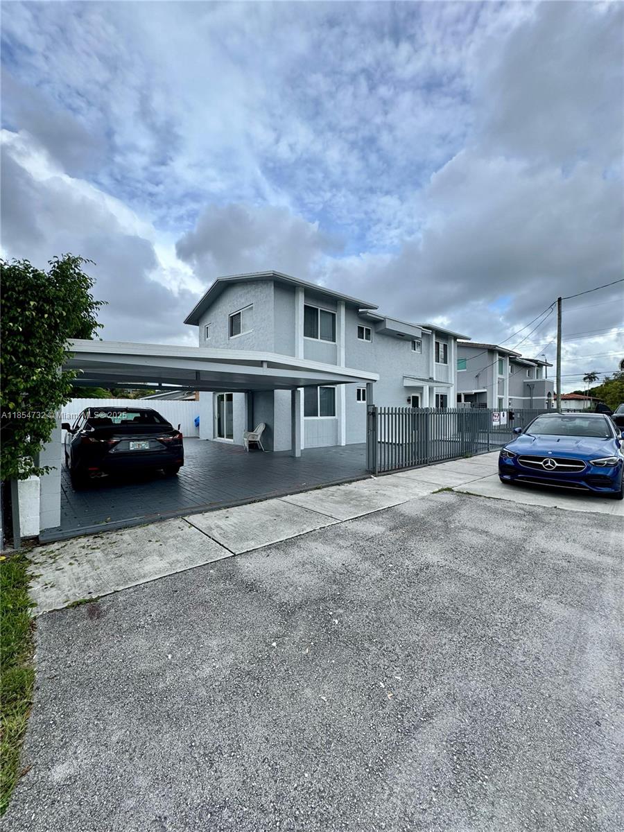 1671 Southwest 29th Avenue Miami, FL 33145 - Photo 4 of 21 a view of a car parked in front of a house