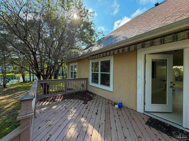 a view of house with a deck