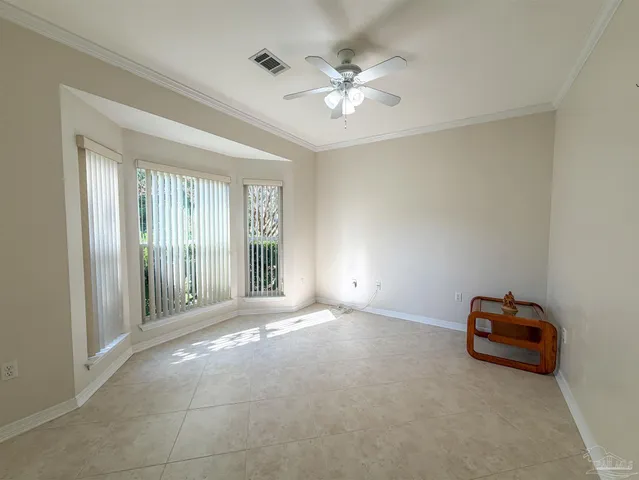 a view of livingroom with projector and fan
