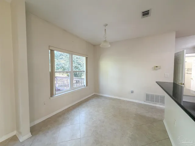 a view of livingroom with furniture flat screen tv and window