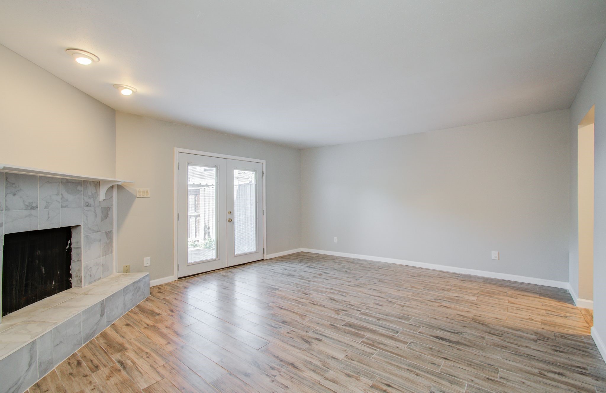 9495 Fondren Road Houston, TX 77074 - Photo 6 of 27 View of the living room with the cozy fireplace