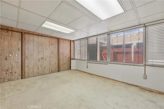 a view of an empty room with a fireplace