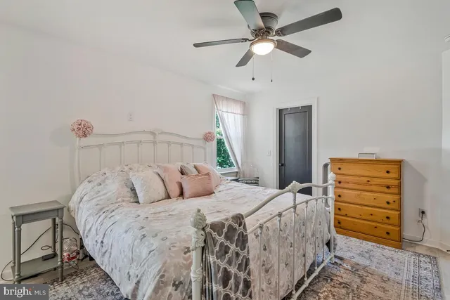 a bedroom with a bed and flat screen tv