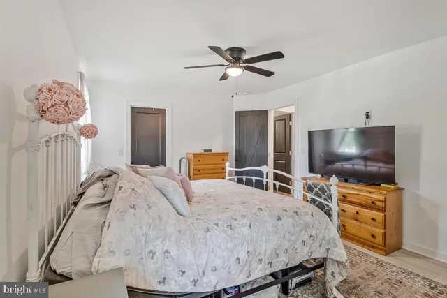 a bathroom with a toilet a sink and a mirror