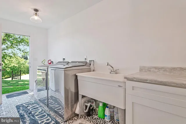 a view of a livingroom with furniture and windows