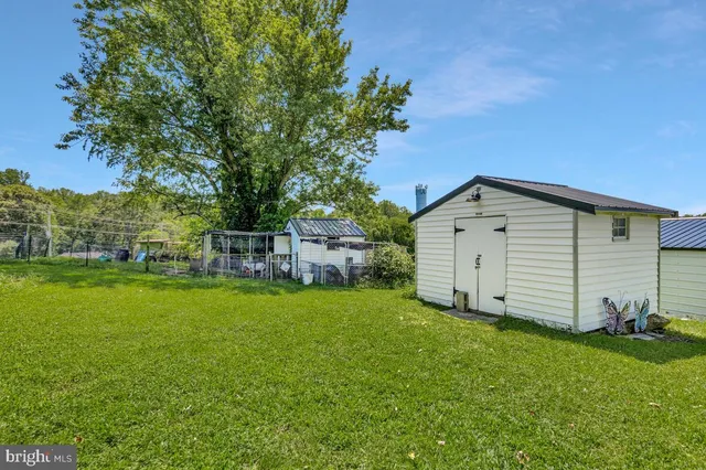 a view of a grassy field with trees