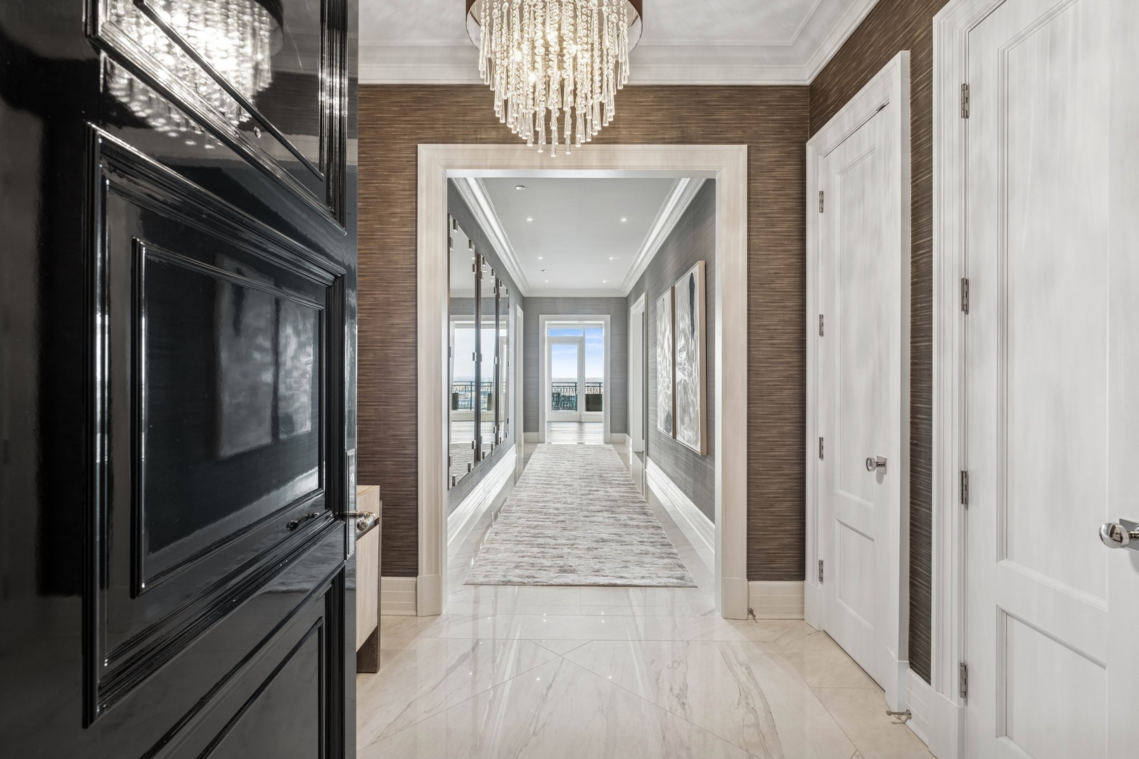 9 West Walton Street, Unit 2802 Chicago, IL 60610 - Photo 4 of 44 a view of a hallway with wooden floor windows and livingroom