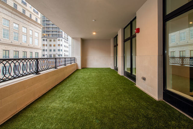 9 West Walton Street, Unit 2802 Chicago, IL 60610 - Photo 43 of 44 a view of a porch with a floor to ceiling window