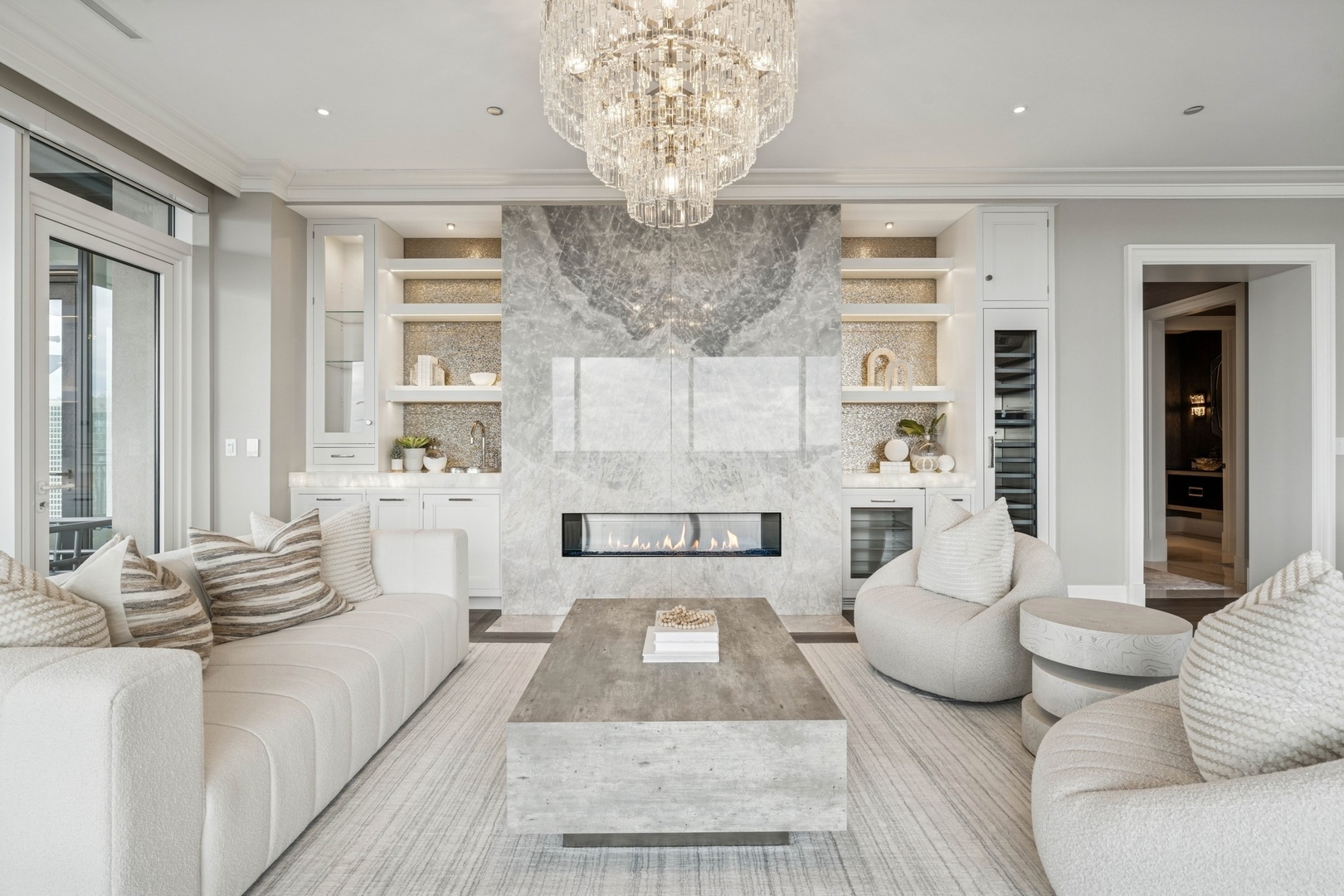 9 West Walton Street, Unit 2802 Chicago, IL 60610 - Photo 5 of 44 a living room with furniture and a chandelier