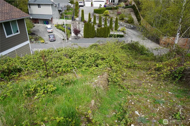 a view of a patio with table and chairs and potted plants