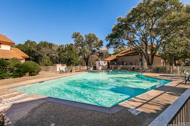 a view of a park with large trees