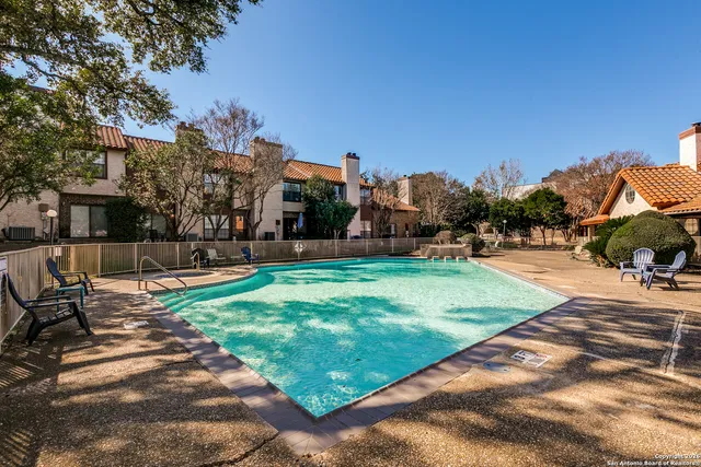 a view of a park with houses