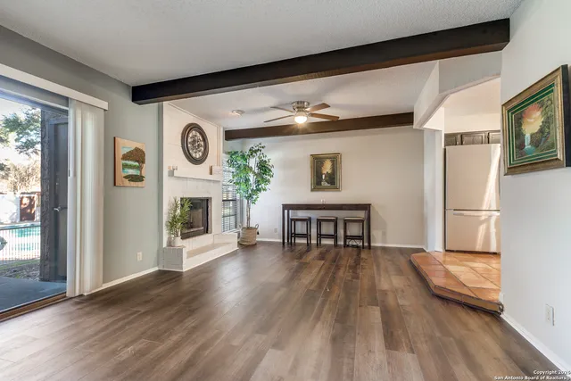 a view of a livingroom with furniture and a fireplace