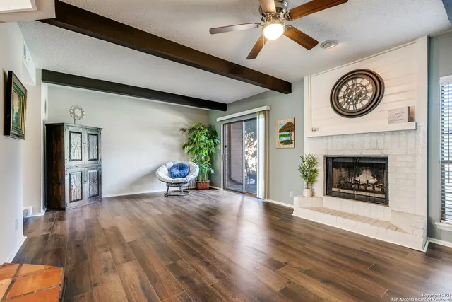 a view of a livingroom with furniture and a fireplace