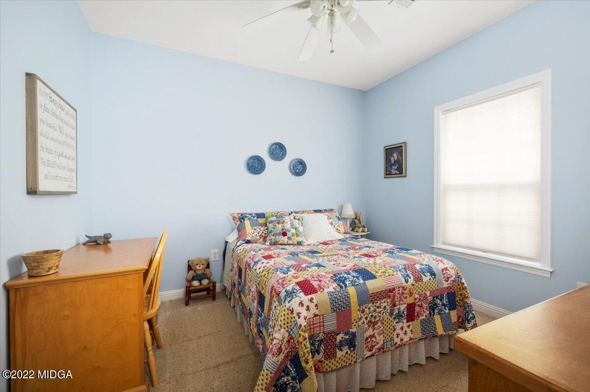 505 Gordon Road Forsyth, GA 31029 - Photo 18 of 38 a bedroom with a bed and a window