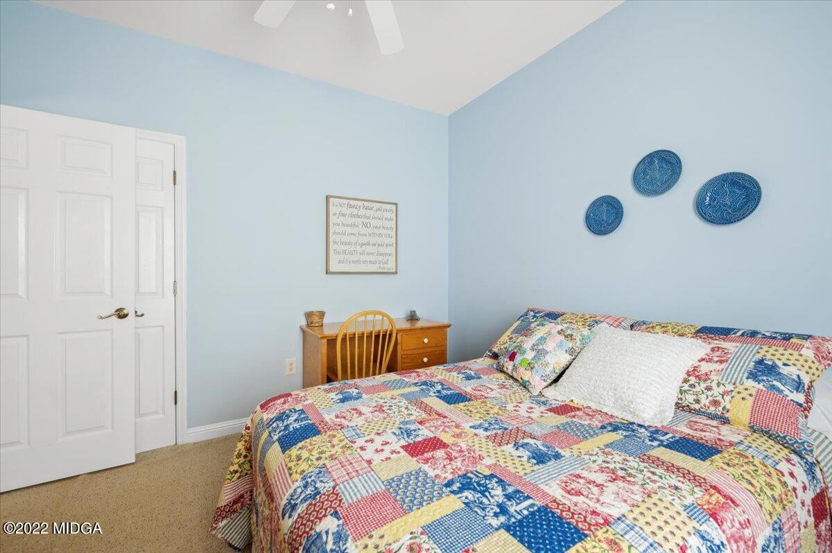 505 Gordon Road Forsyth, GA 31029 - Photo 38 of 38 a bedroom with a bed and a painting on the wall