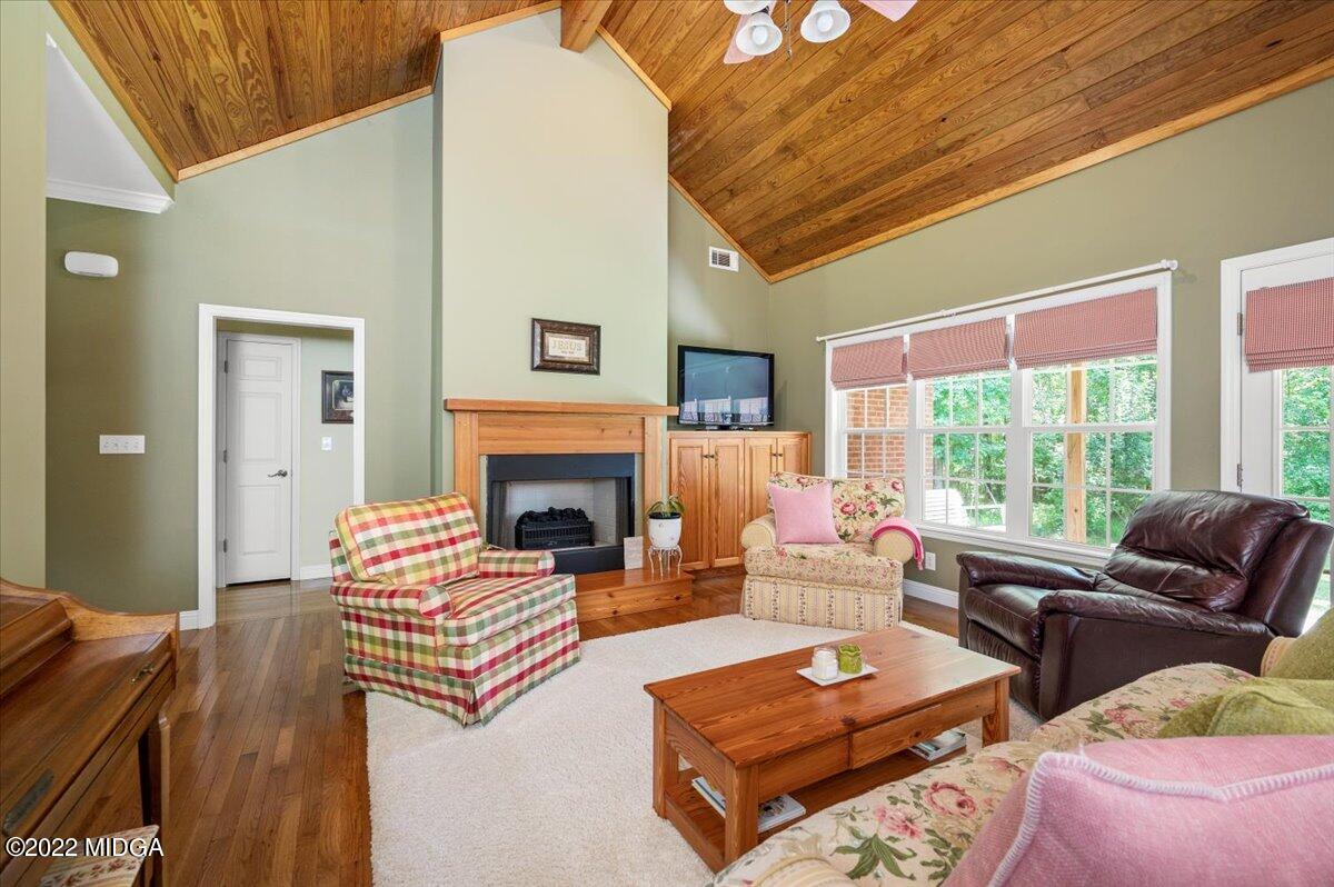 505 Gordon Road Forsyth, GA 31029 - Photo 6 of 38 a living room with furniture fireplace and large window