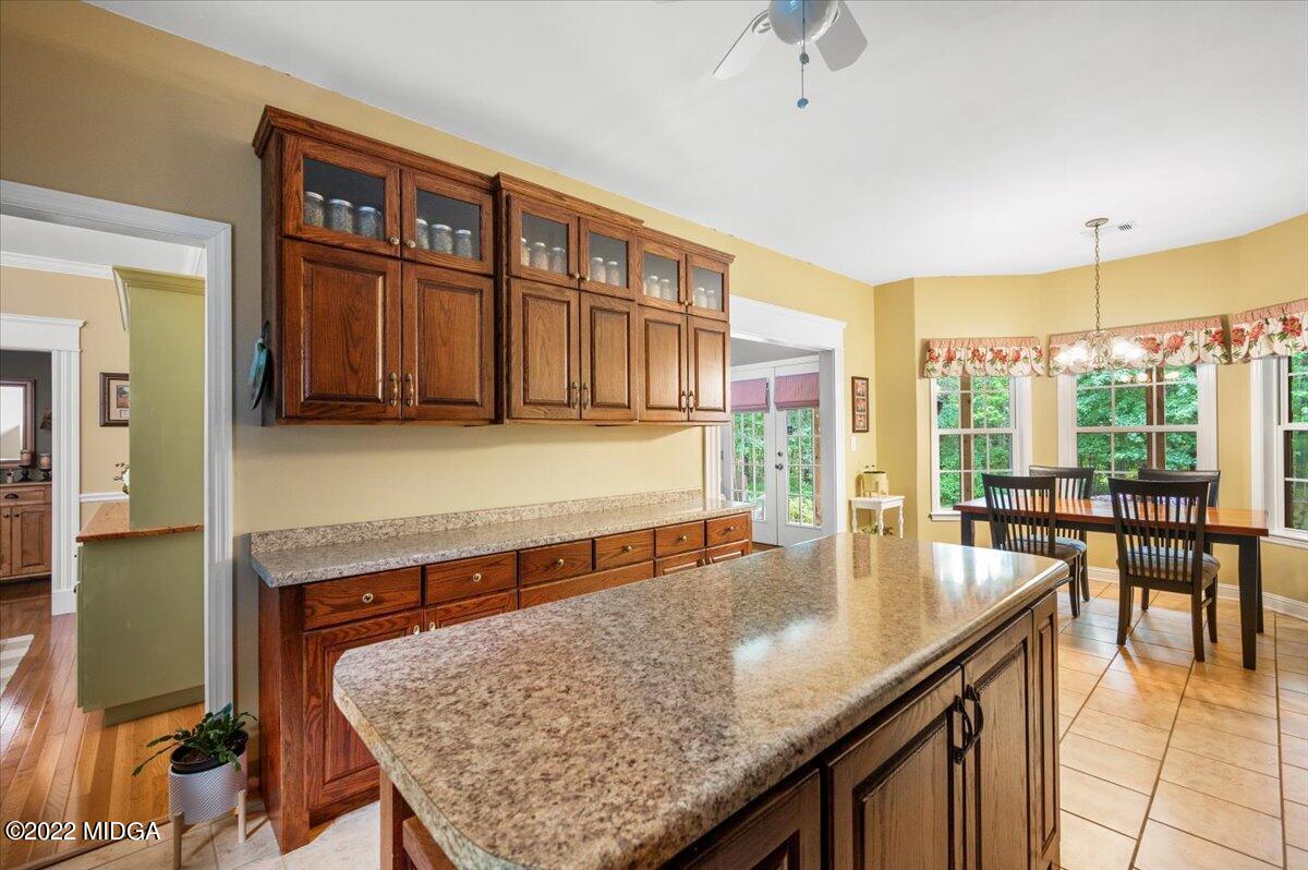 505 Gordon Road Forsyth, GA 31029 - Photo 9 of 38 a kitchen with a table chairs and wooden floor