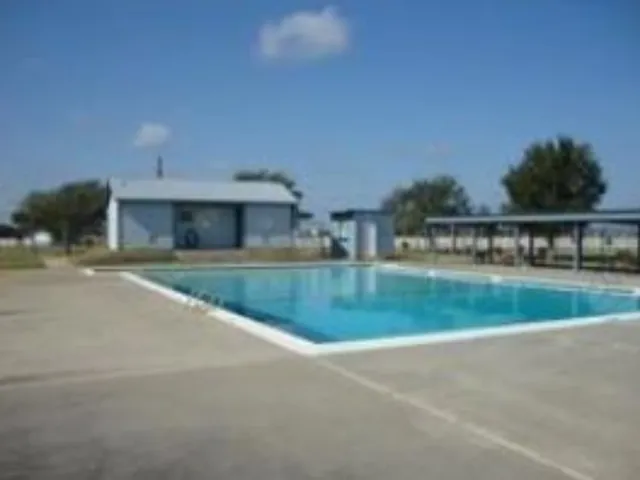 a view of house with outdoor space and sitting area