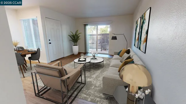 a living room with furniture a window and wooden floor