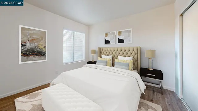 a bedroom with a large bed and a window