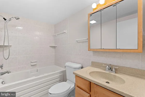 a front view of a brick building with a yard