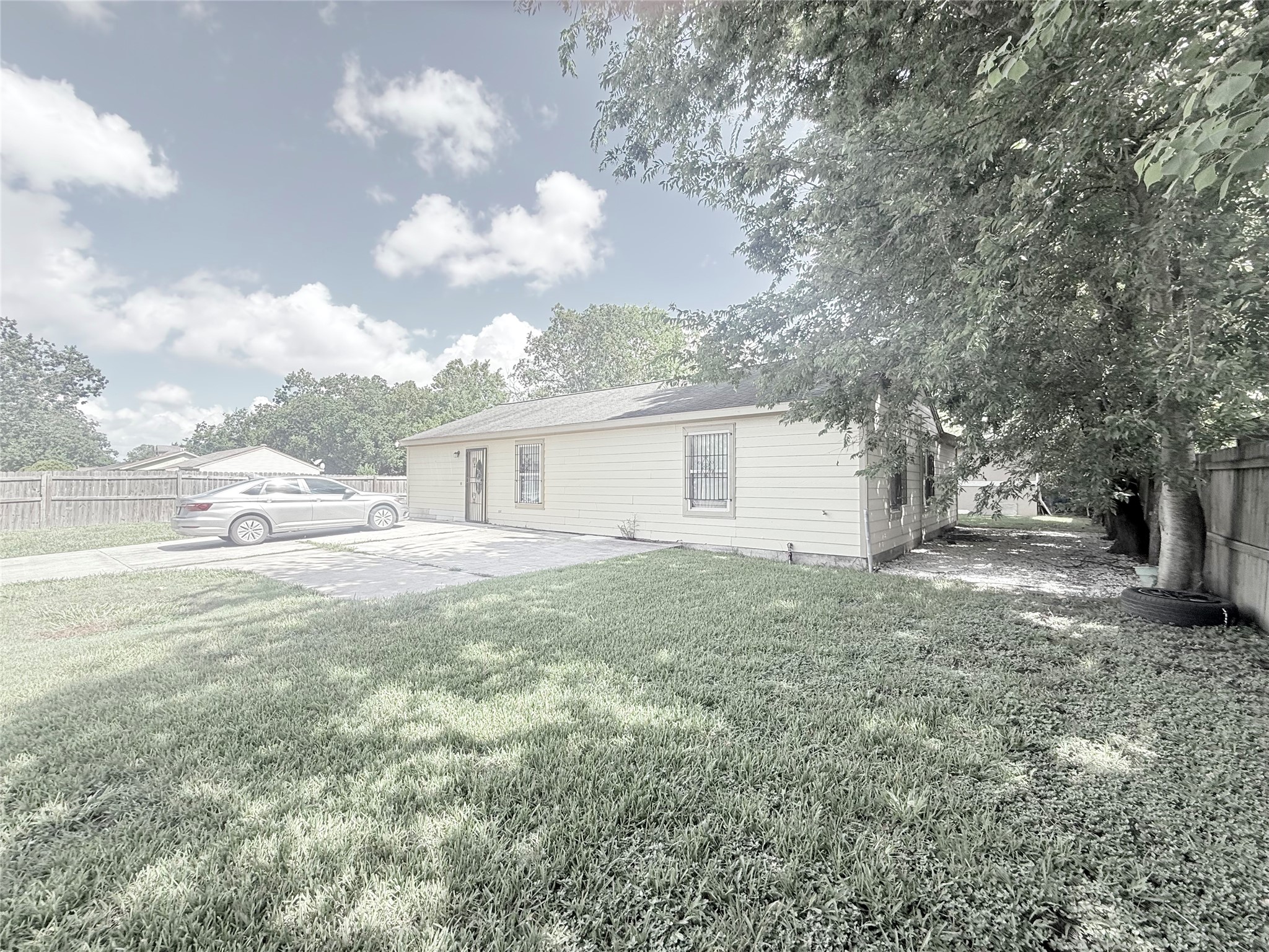 5103 Northridge Drive Houston, TX 77033 - Photo 2 of 39 a view of a backyard with large trees