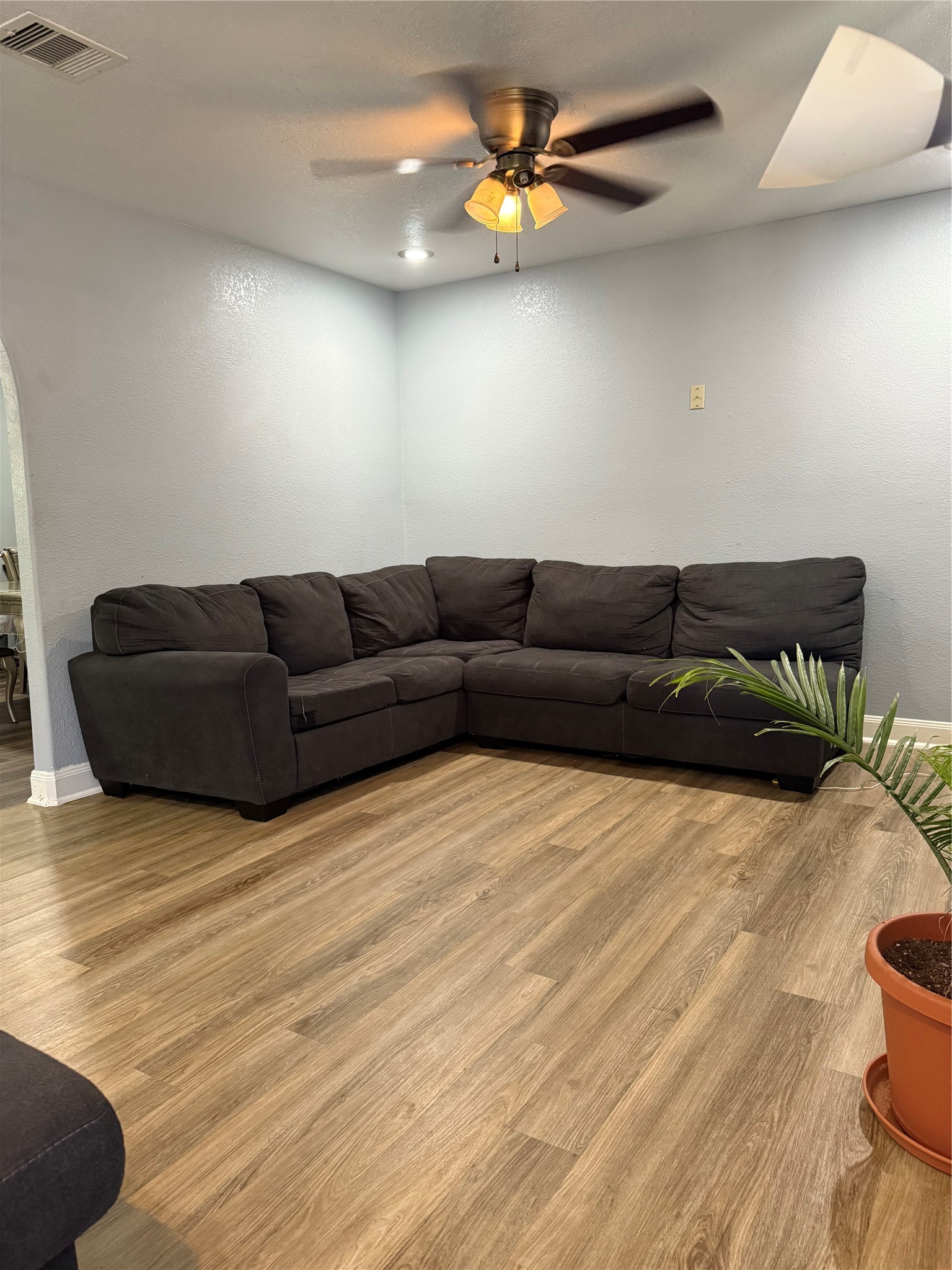 5103 Northridge Drive Houston, TX 77033 - Photo 23 of 39 a living room with furniture and a wooden floor