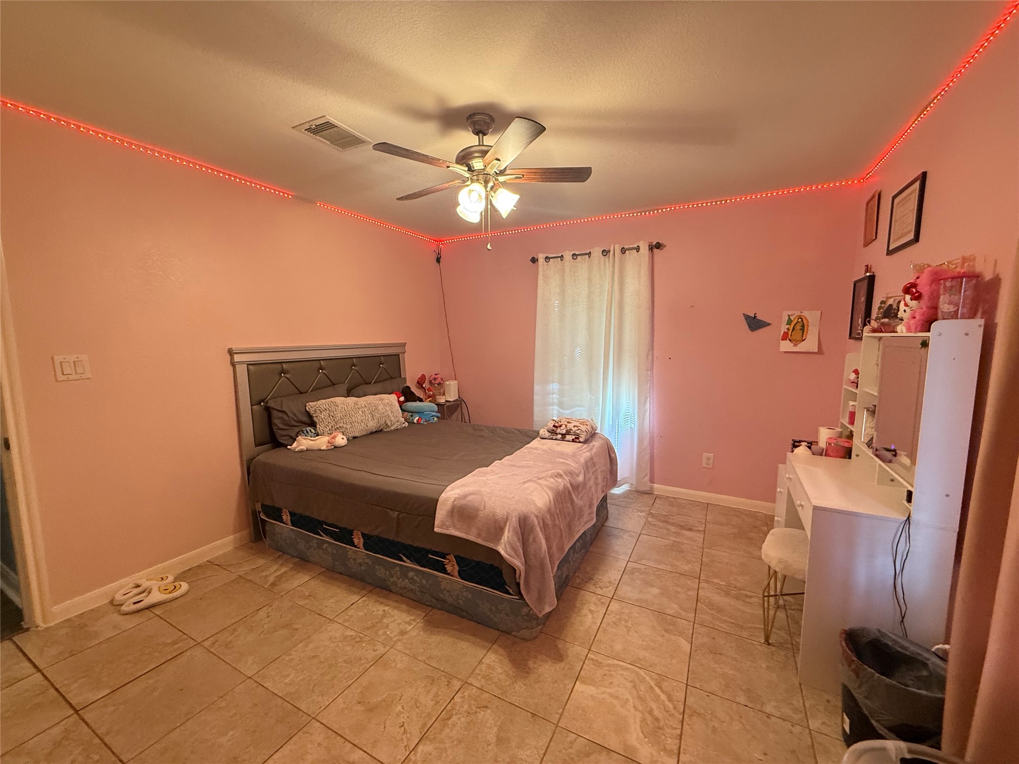 5103 Northridge Drive Houston, TX 77033 - Photo 25 of 39 a bedroom with a bed and a chandelier