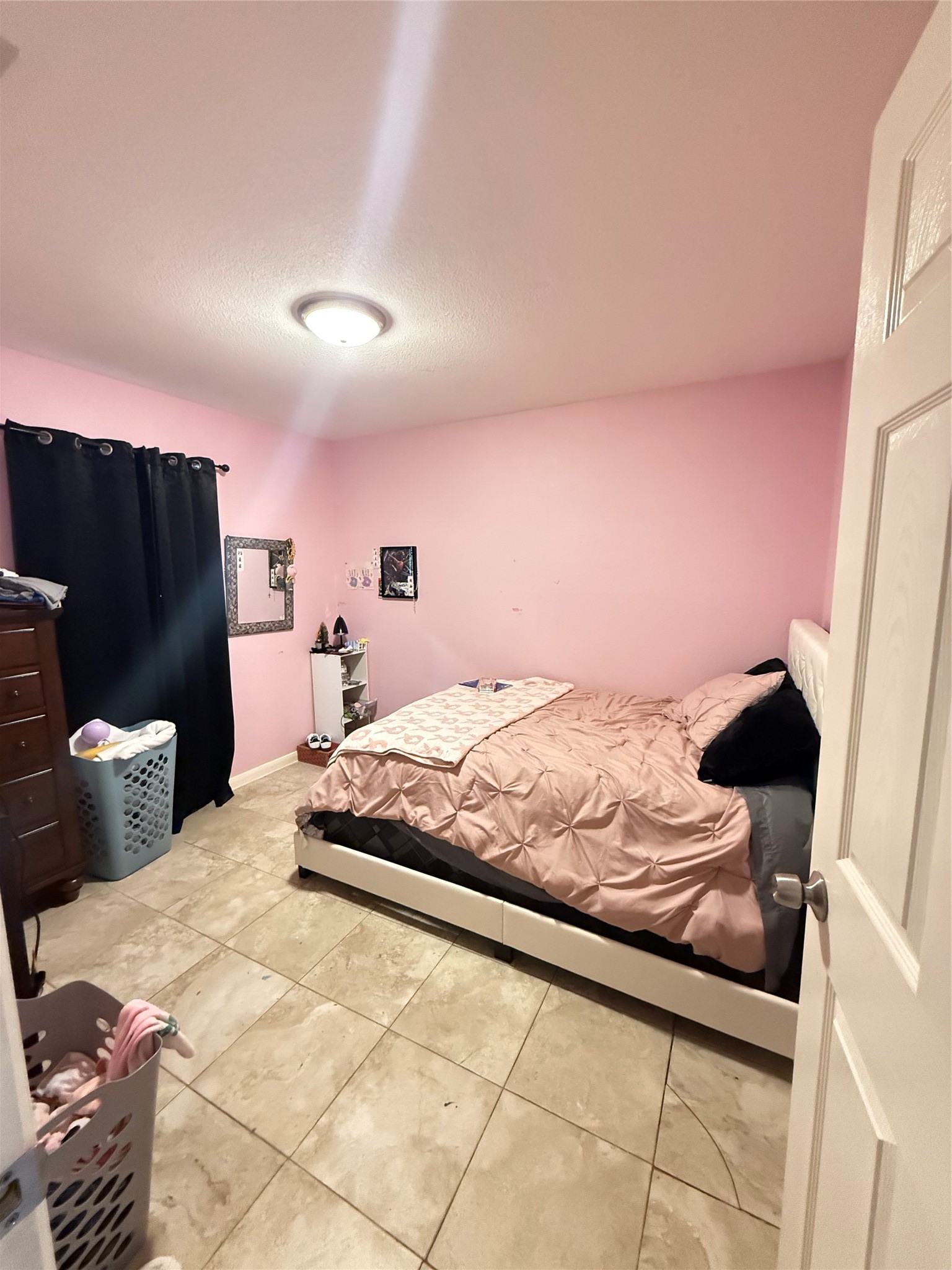 5103 Northridge Drive Houston, TX 77033 - Photo 27 of 39 a bedroom with a bed and wooden floor