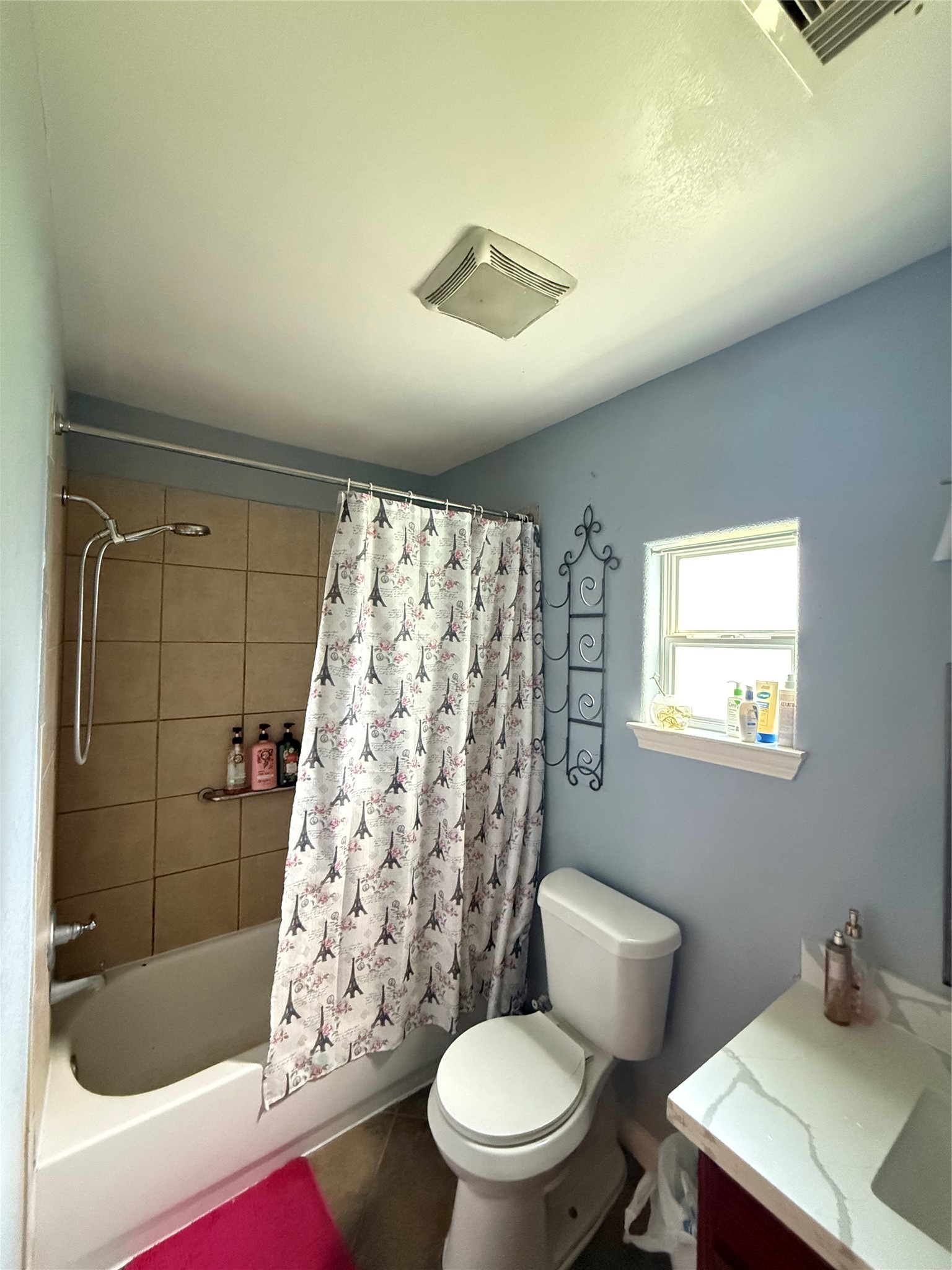 5103 Northridge Drive Houston, TX 77033 - Photo 28 of 39 a bathroom with a sink a toilet a shower and a window