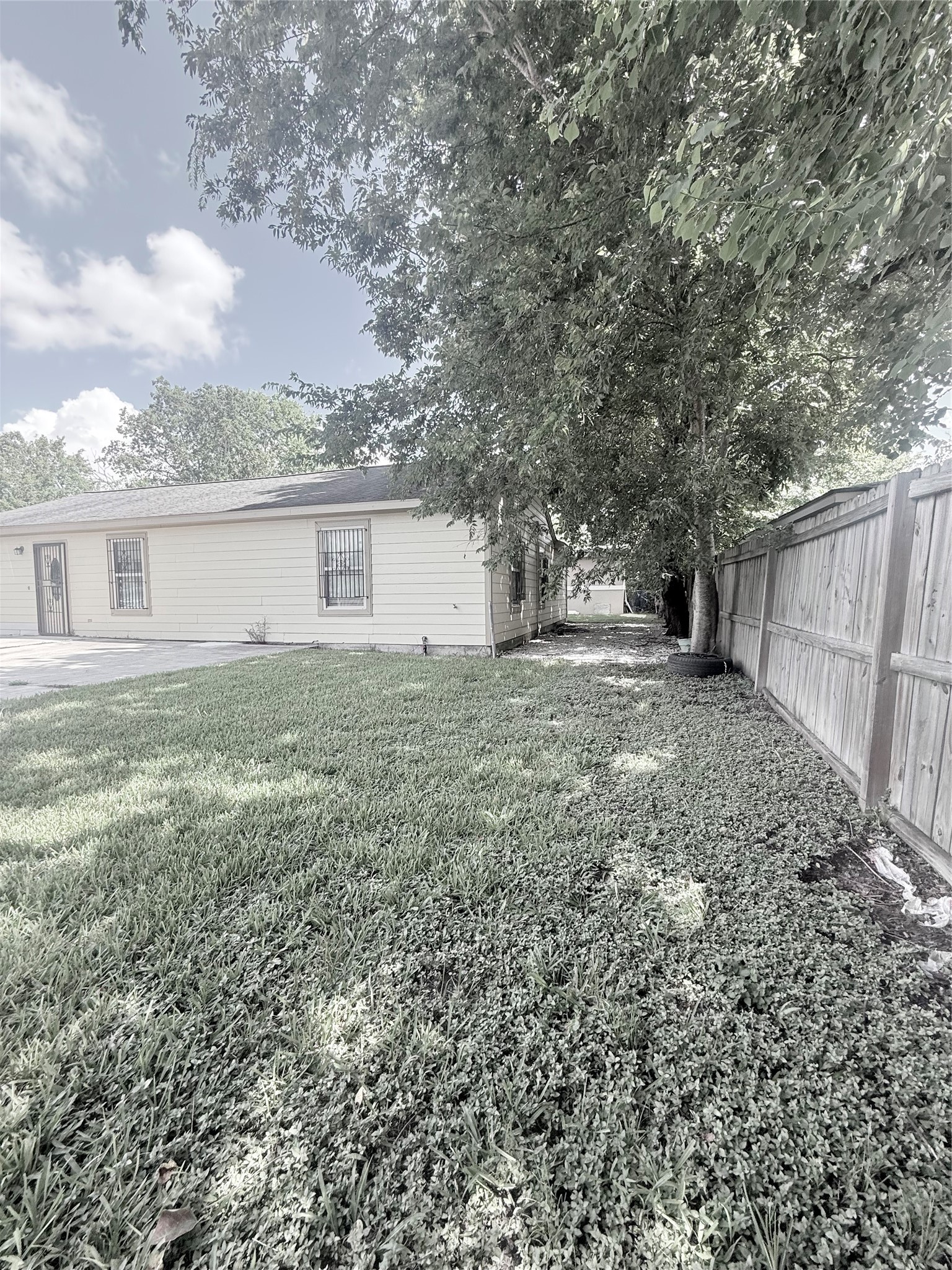 5103 Northridge Drive Houston, TX 77033 - Photo 7 of 39 a view of a backyard with a tree