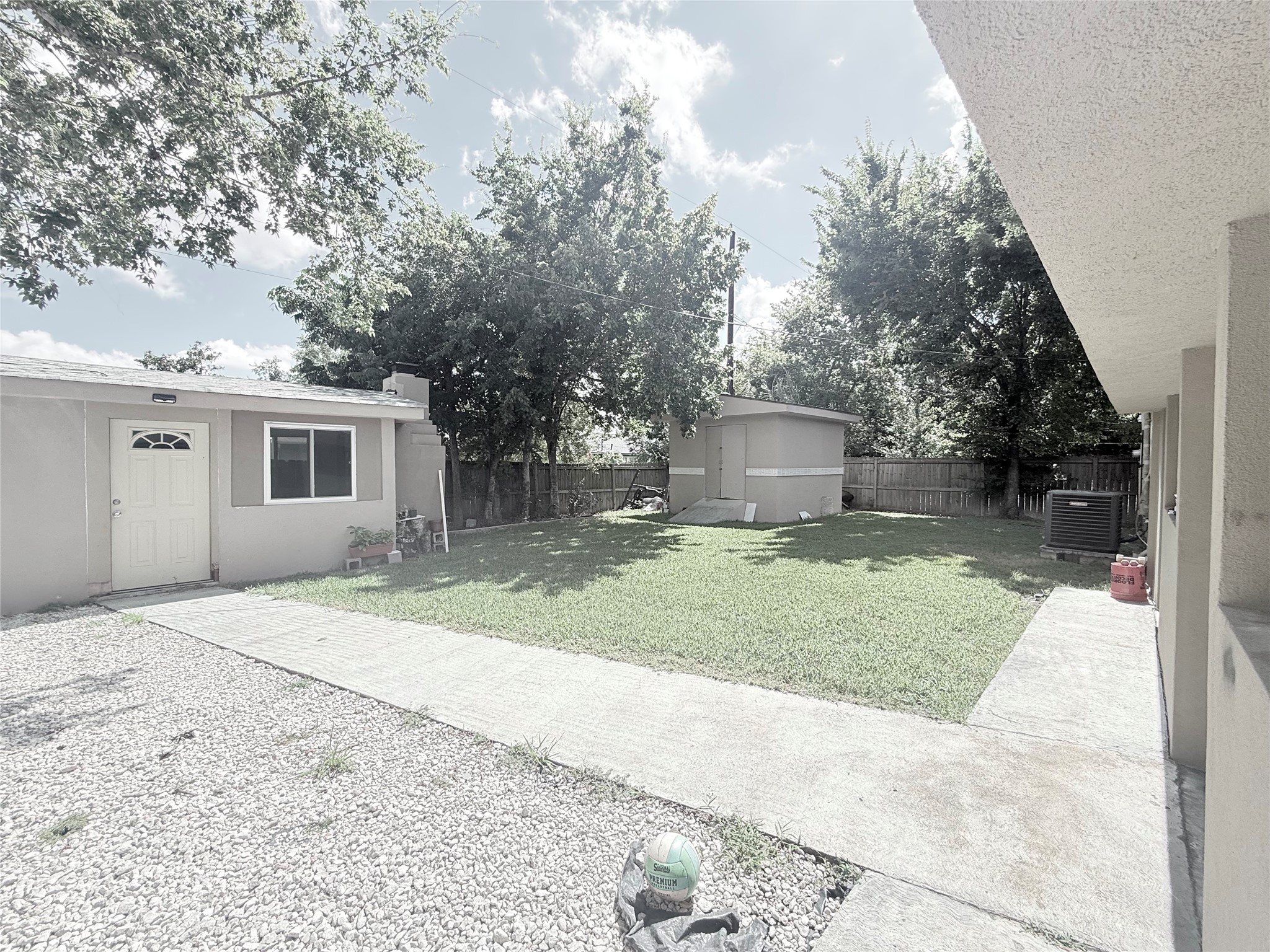 5103 Northridge Drive Houston, TX 77033 - Photo 9 of 39 a backyard of a house with large trees and barbeque oven