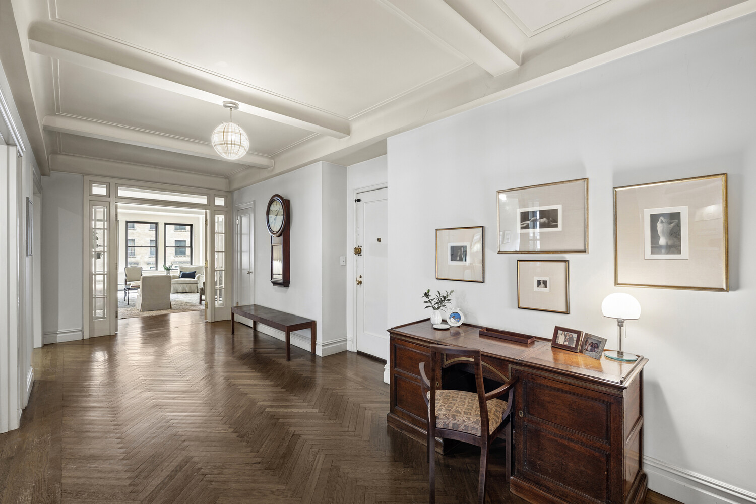 25 East 86th Street, Unit 4B Manhattan, NY 10028 - Photo 13 of 16 a view of a livingroom with furniture and wooden floor