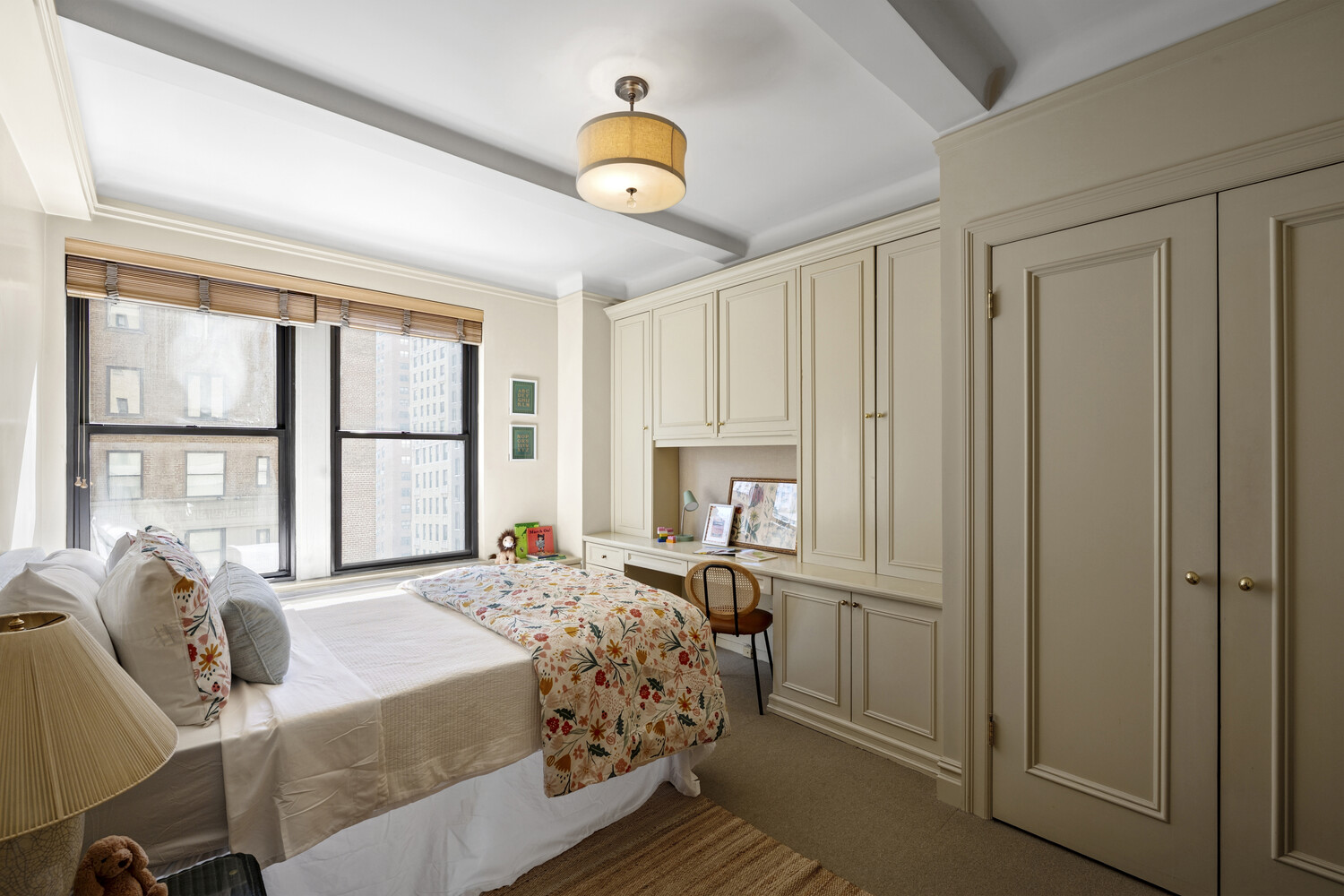 25 East 86th Street, Unit 4B Manhattan, NY 10028 - Photo 6 of 16 a bedroom with a bed and a window