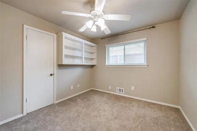 a bathroom with a granite countertop sink a mirror and a vanity