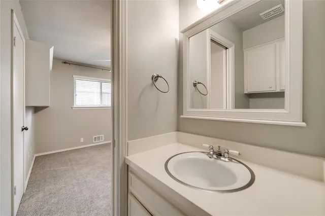 a view of a house with backyard sitting area and garden