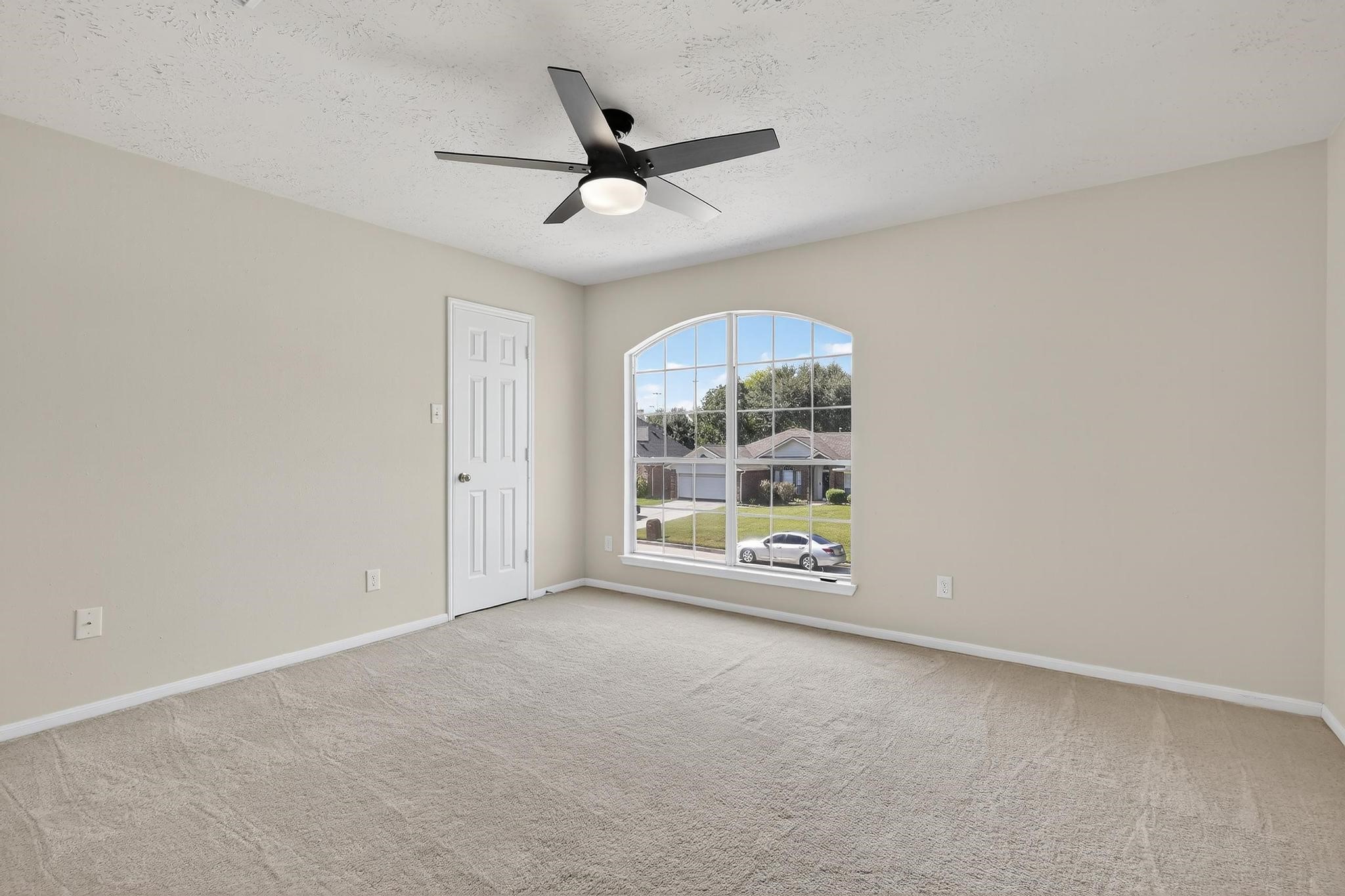 20926 Trellis Lane Houston, TX 77073 - Photo 23 of 24 an empty room with a ceiling fan and window