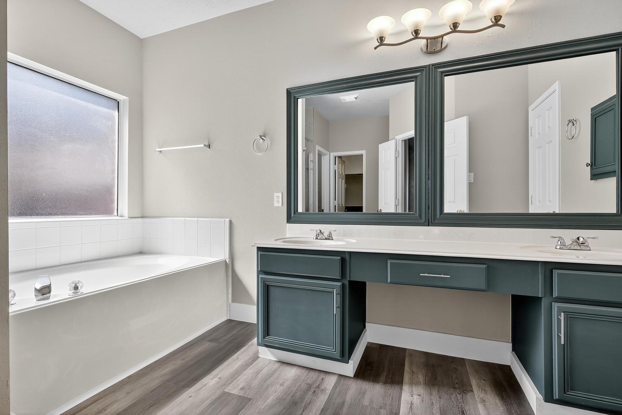 20926 Trellis Lane Houston, TX 77073 - Photo 8 of 24 a bathroom with a sink and a mirror