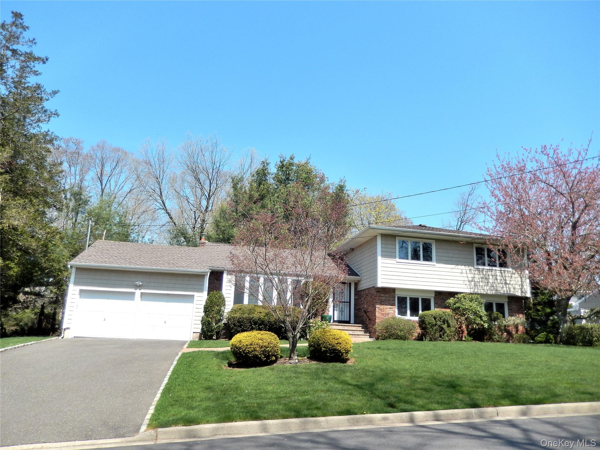 a view of house with yard and entertaining space