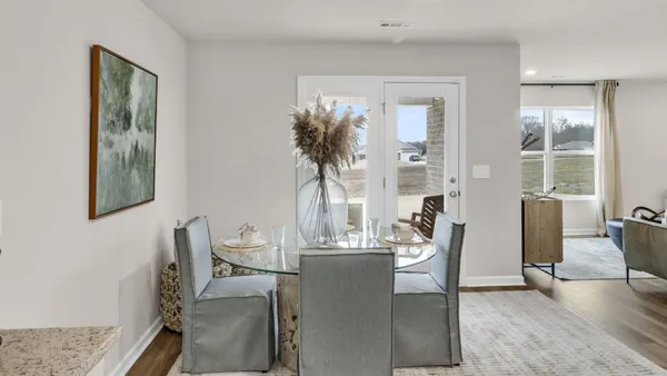 a living room with furniture and windows