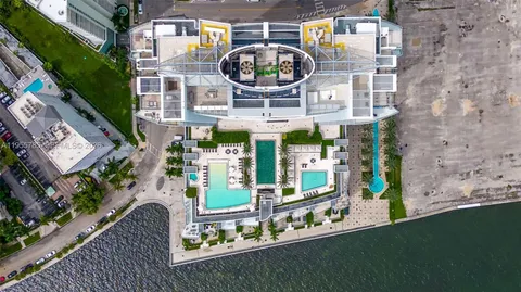 a view of a swimming pool with a lake view