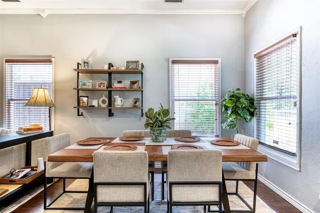 a dining room with furniture and window
