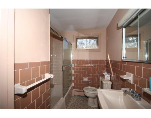 21 Whitney Road Newton, MA 02460 - Photo 13 of 14 a bathroom with a sink and a mirror